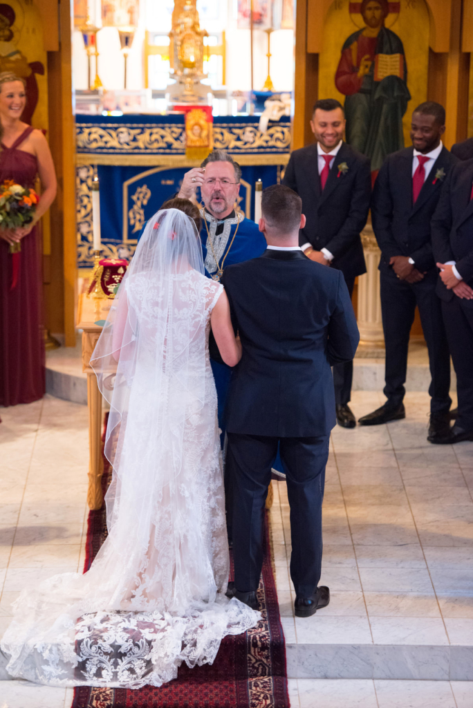 A Maine wedding with a ceremony at St Nicolas Greek Orthodox Church in Portsmouth New Hampshire