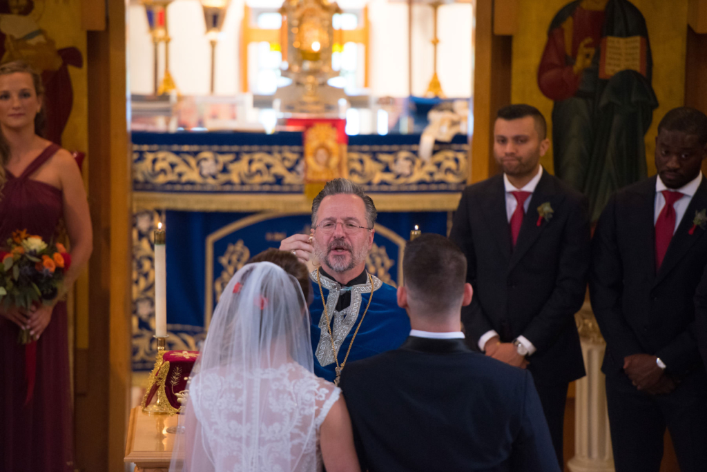 A Maine wedding with a ceremony at St Nicolas Greek Orthodox Church in Portsmouth New Hampshire