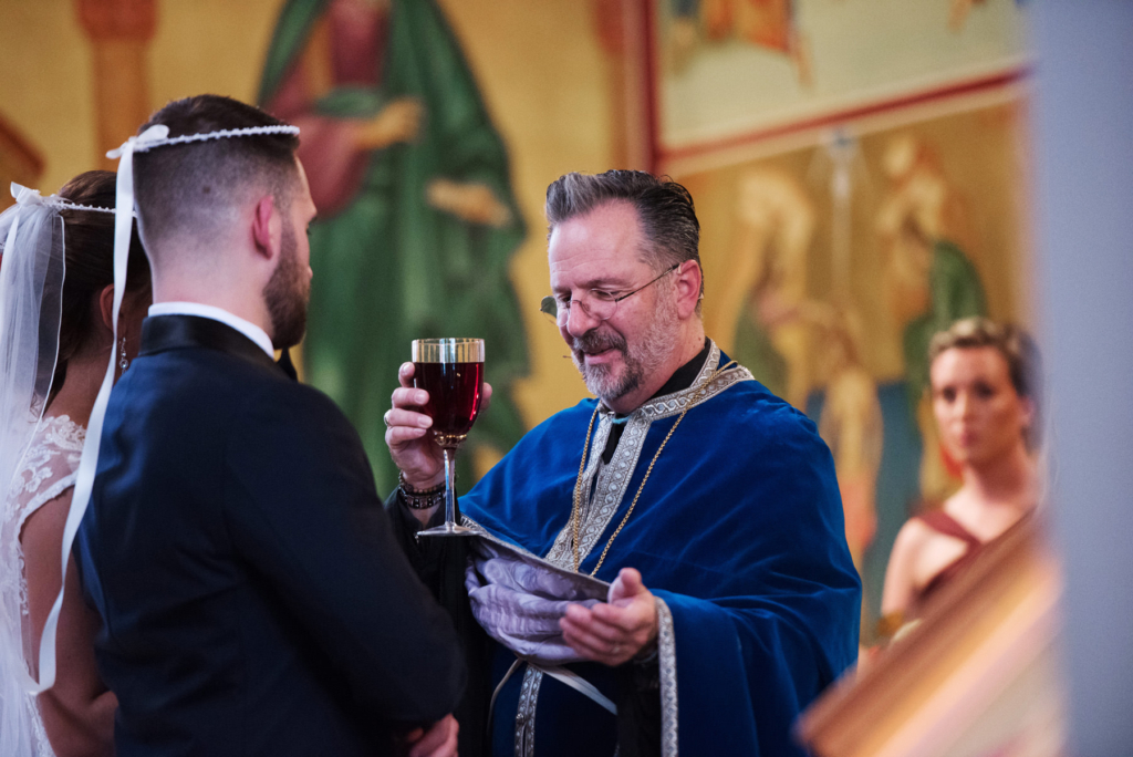 A Maine wedding with a ceremony at St Nicolas Greek Orthodox Church in Portsmouth New Hampshire