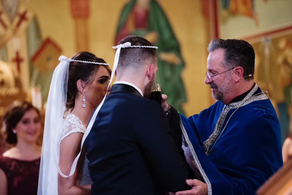 A Maine wedding with a ceremony at St Nicolas Greek Orthodox Church in Portsmouth New Hampshire