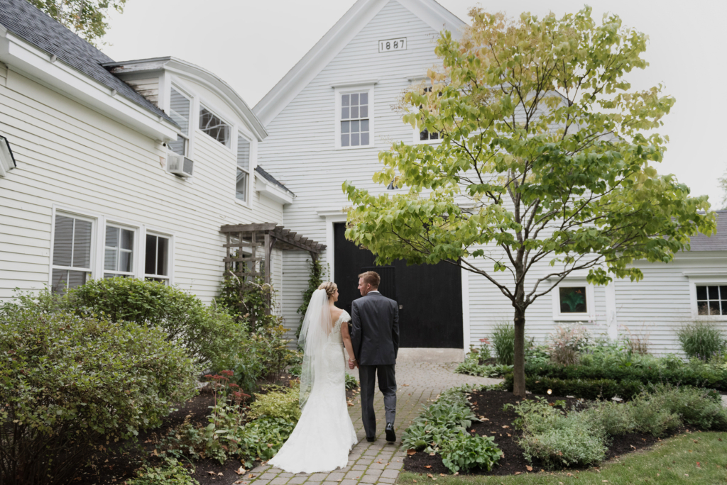 In front of The Barn on Walnut Hill on their wedding day