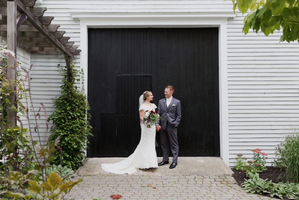 In front of The Barn on Walnut Hill on their wedding day