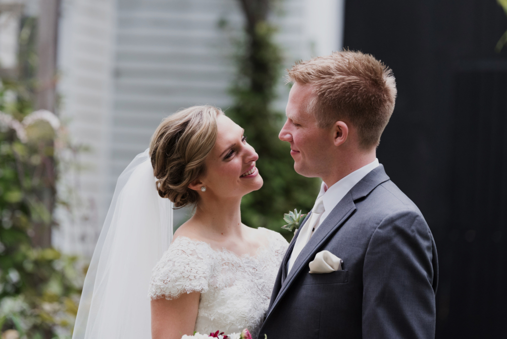 In front of The Barn on Walnut Hill on their wedding day