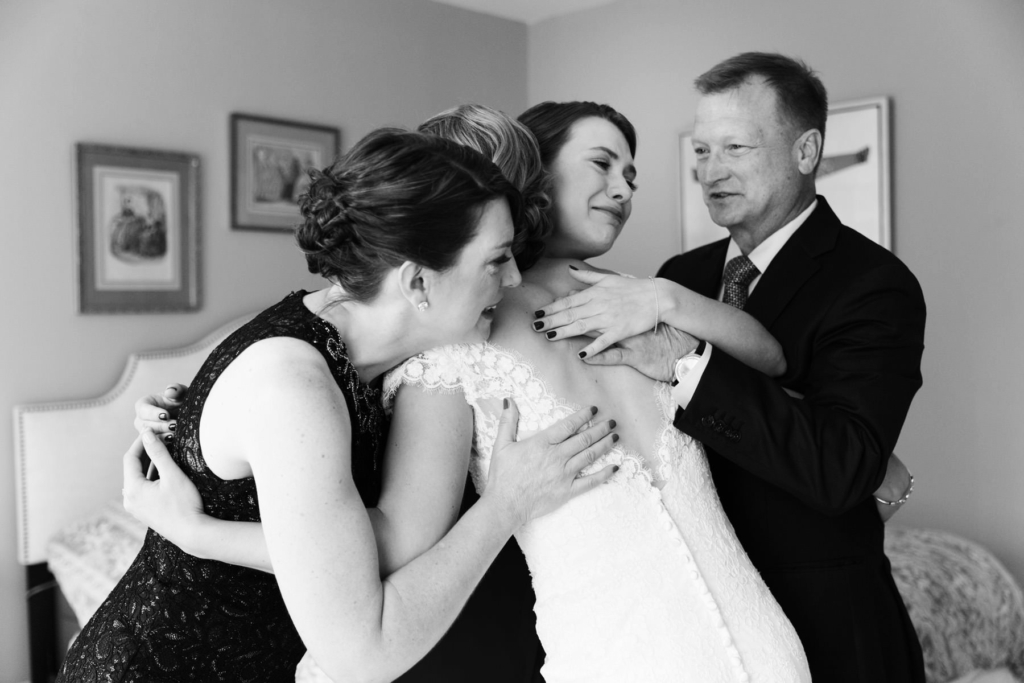 Mom, Dad, a sister and a bride, excited and happy on the big day